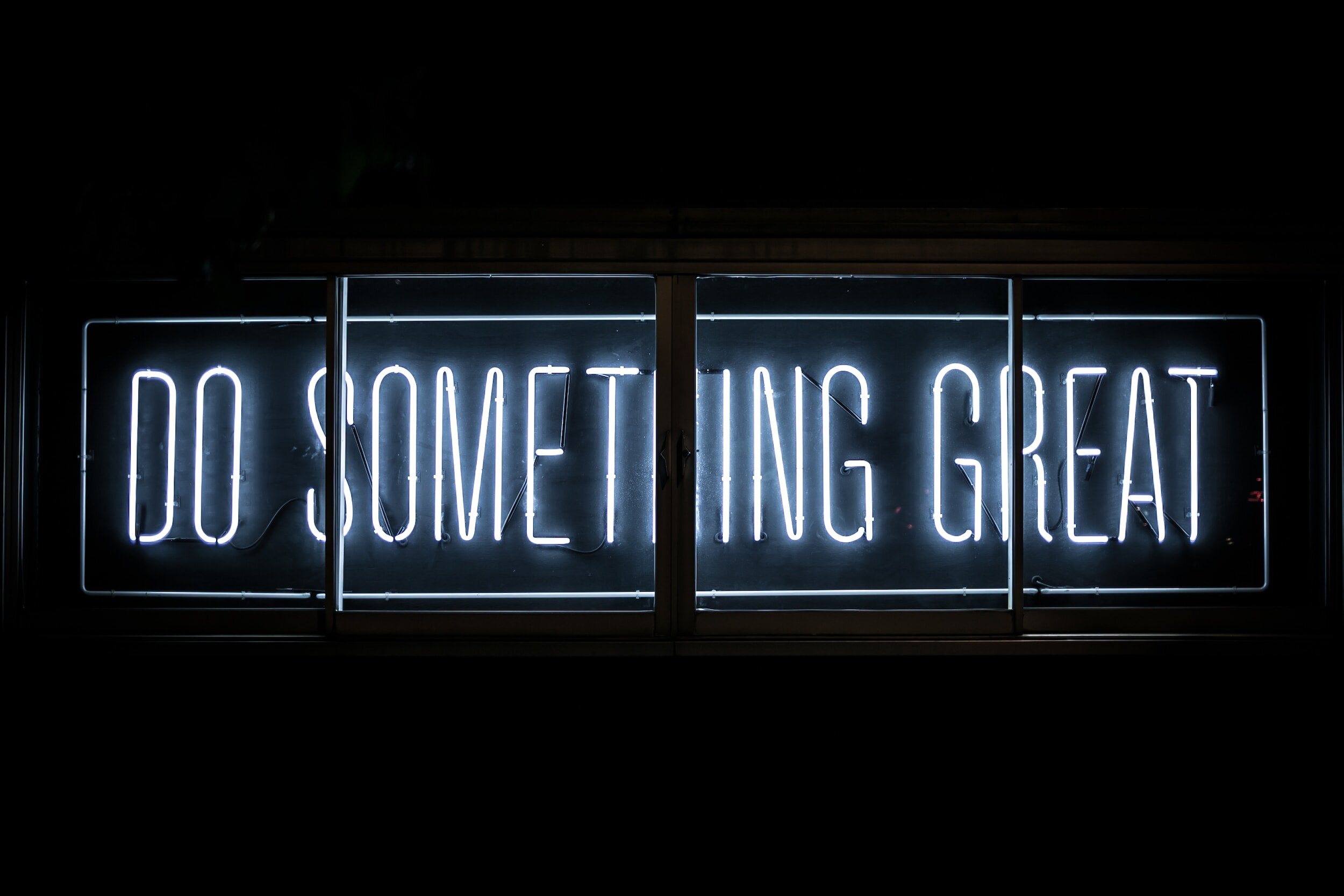 "Do Something Great" in neon letters